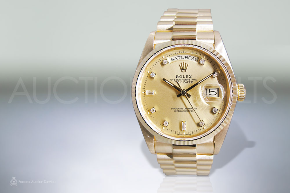 Men's 18k Yellow Gold Rolex Day-Date Automatic Wristwatch sold for $15,000