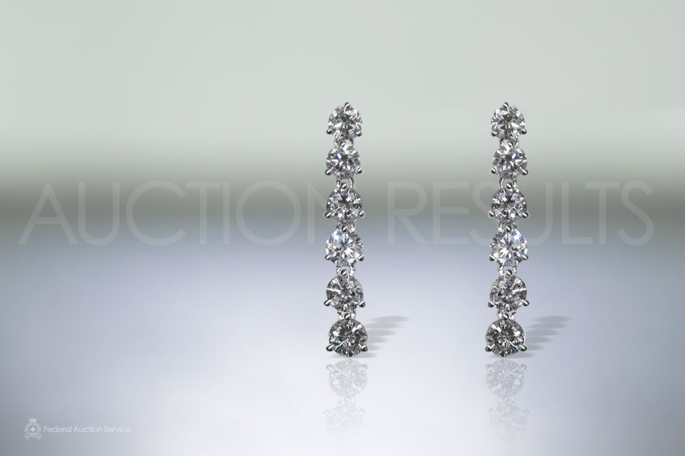 Lady's 18k White Gold Diamond Dangling Earrings sold for $3,600