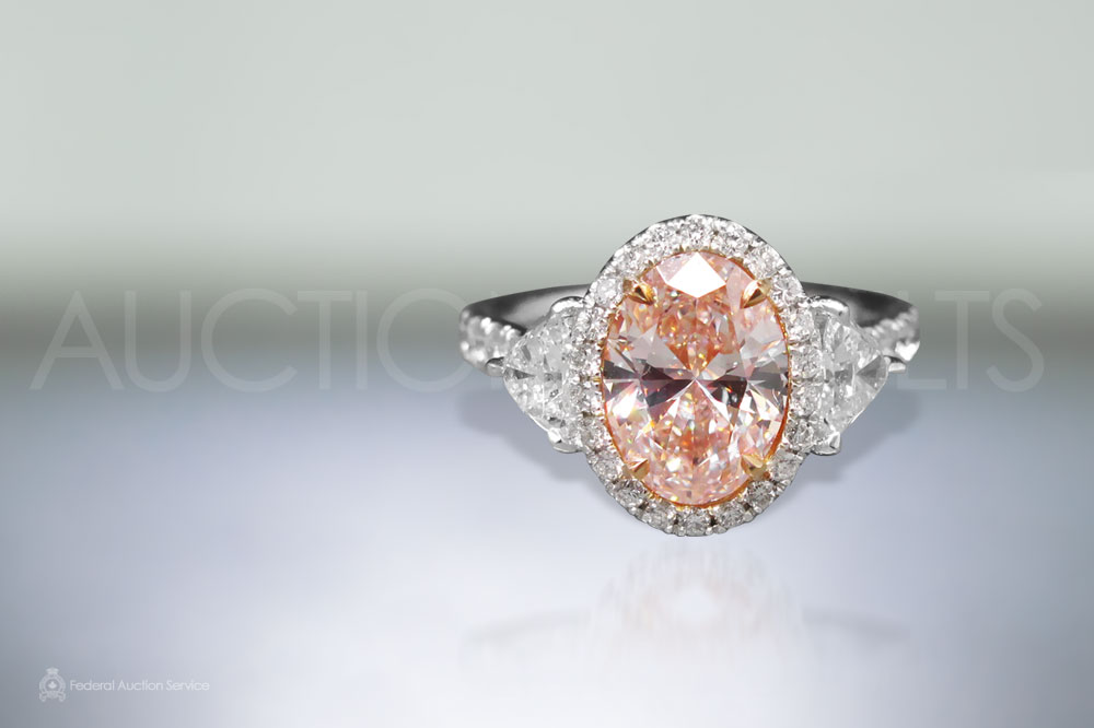Lady's Platinum and Rose Gold 2.05ct Oval Cut Fancy Light Pink Diamond Ring sold for $51,000