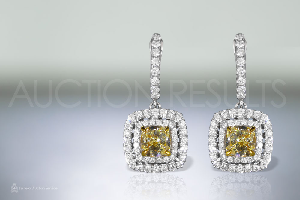 EGL Certified 2ct (TDW) Fancy Yellow Diamond Earrings sold for $14,000