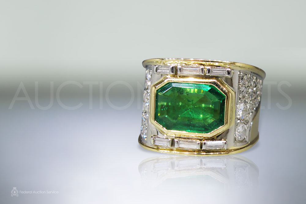 Lady's 18k Yellow/White Gold Emerald and Diamond Ring sold for $4,600