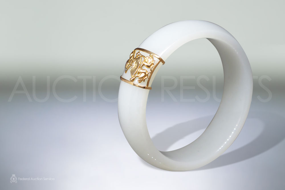 Natural 'Mutton Fat' Nephrite Round Bangle With 18k Yellow Gold Accents sold for $15,000